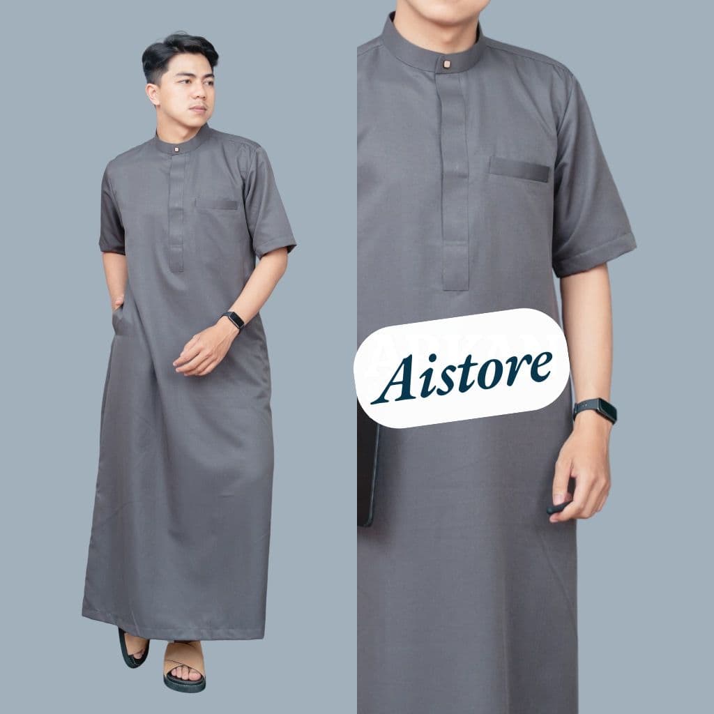 Man modeling a grey short-sleeved thobe featuring a mandarin collar and a chest pocket.